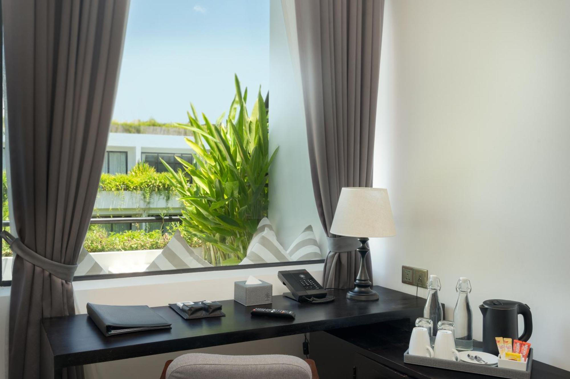 Eightfold Urban Resort Siem Reap Exterior photo A room at the hotel